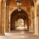 college passageway columns bricks lamps