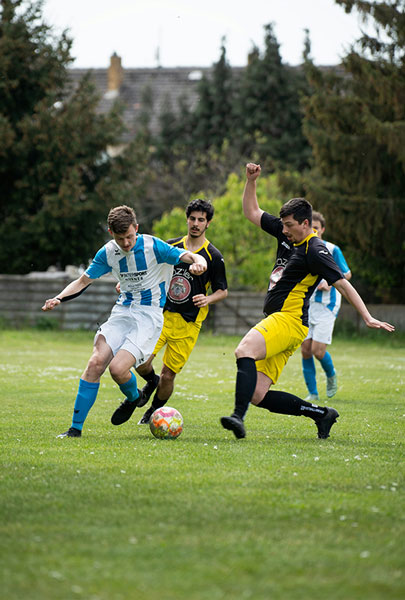 Young men playing soccer