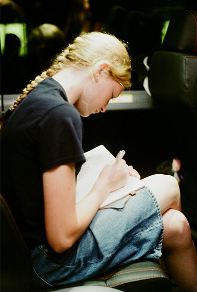Young woman writing